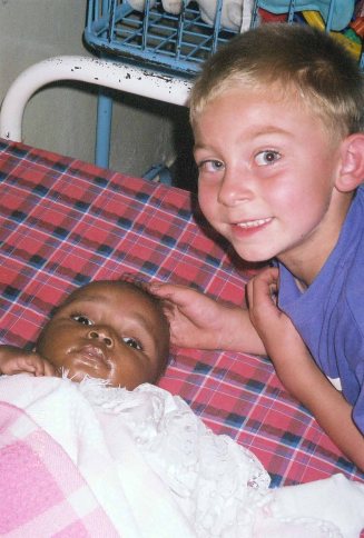 My son with Lily when we met her at the orphanage, 2004